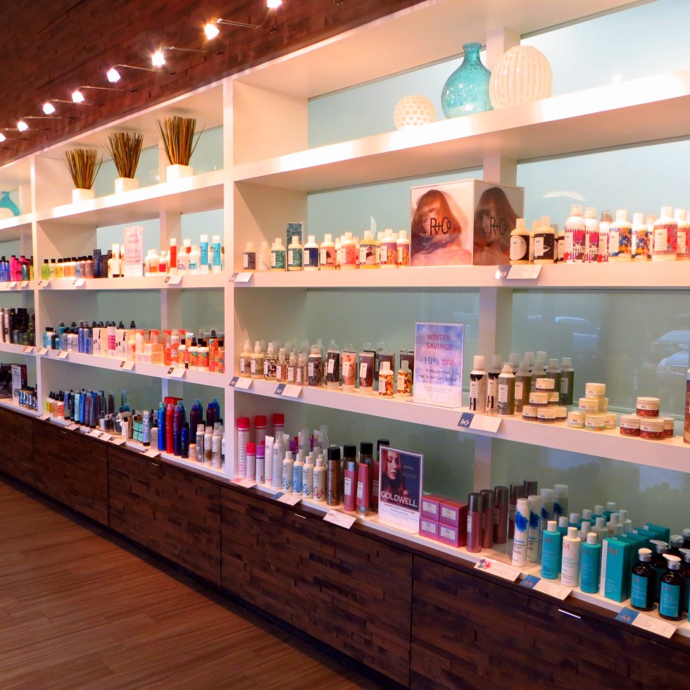 Scatter Joy. Gene Juarez Academy. A rainbow of beauty products on a shelf.